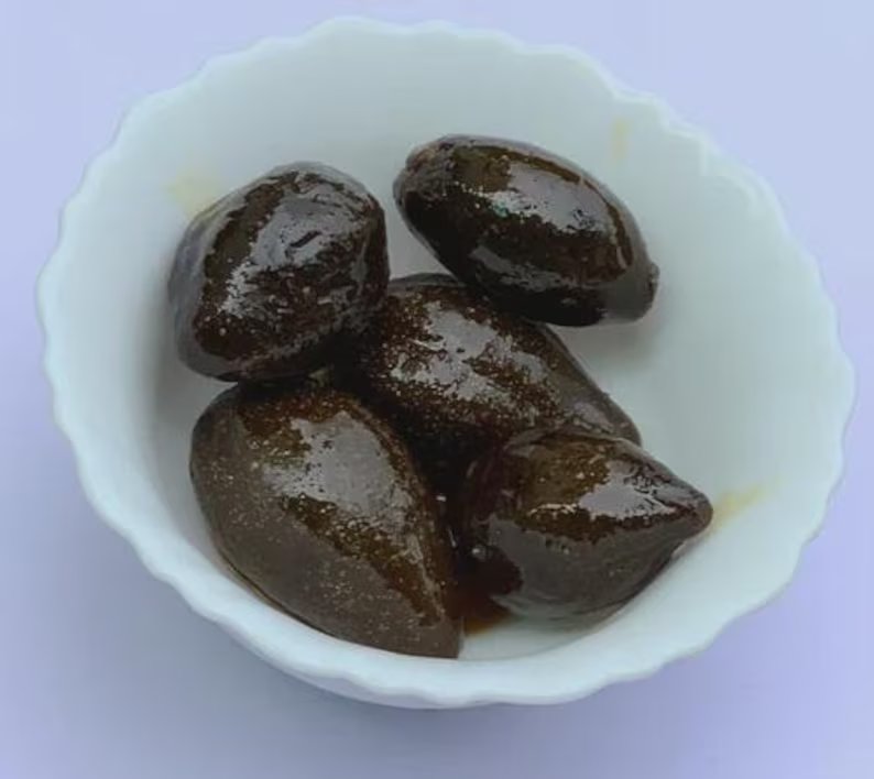 Nueces verdes en almíbar